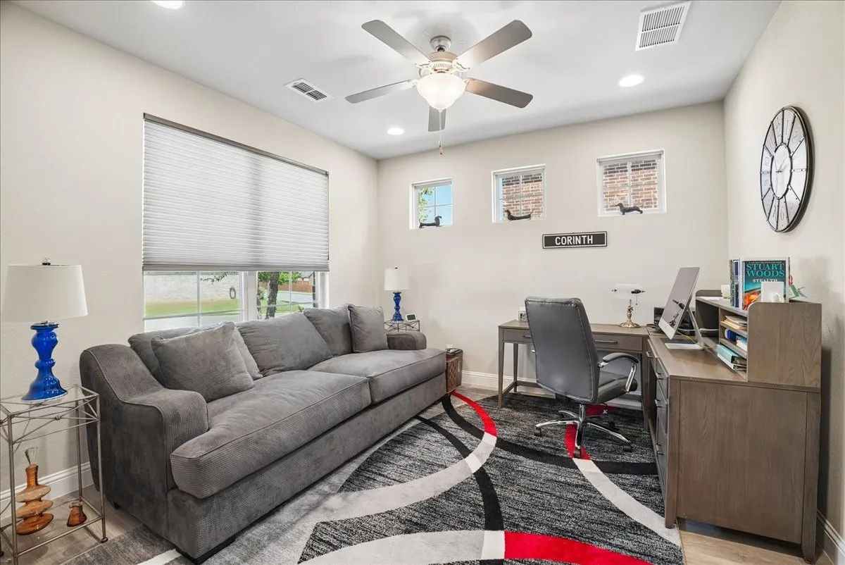 Versatile home office with abundant natural light.
