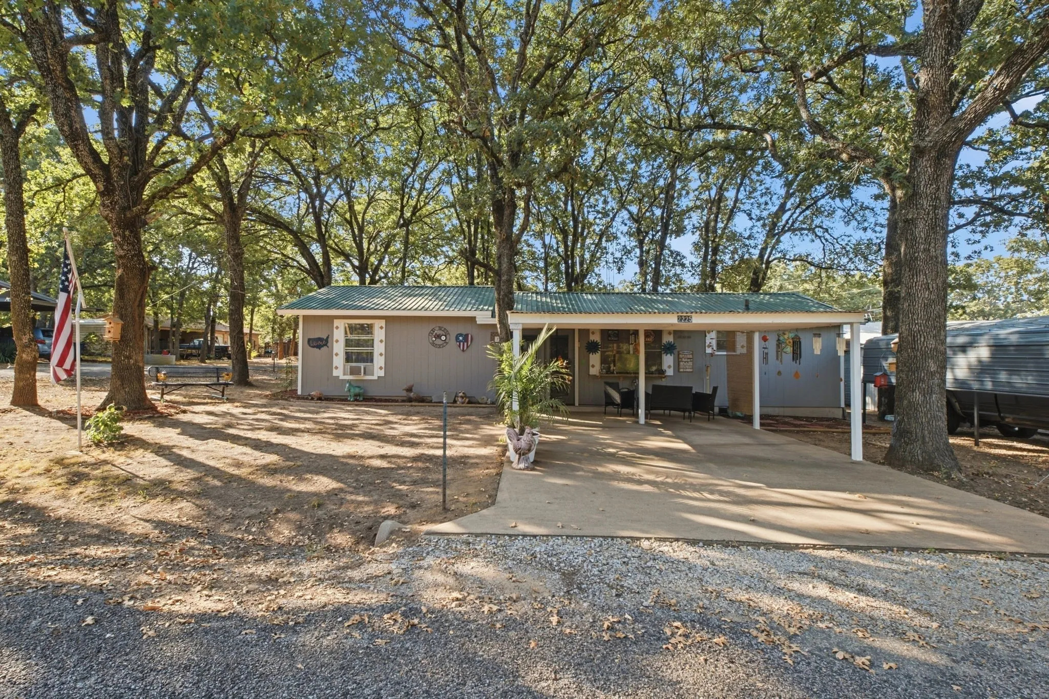 Single-story residence with a covered carport, porch, and a metal roof