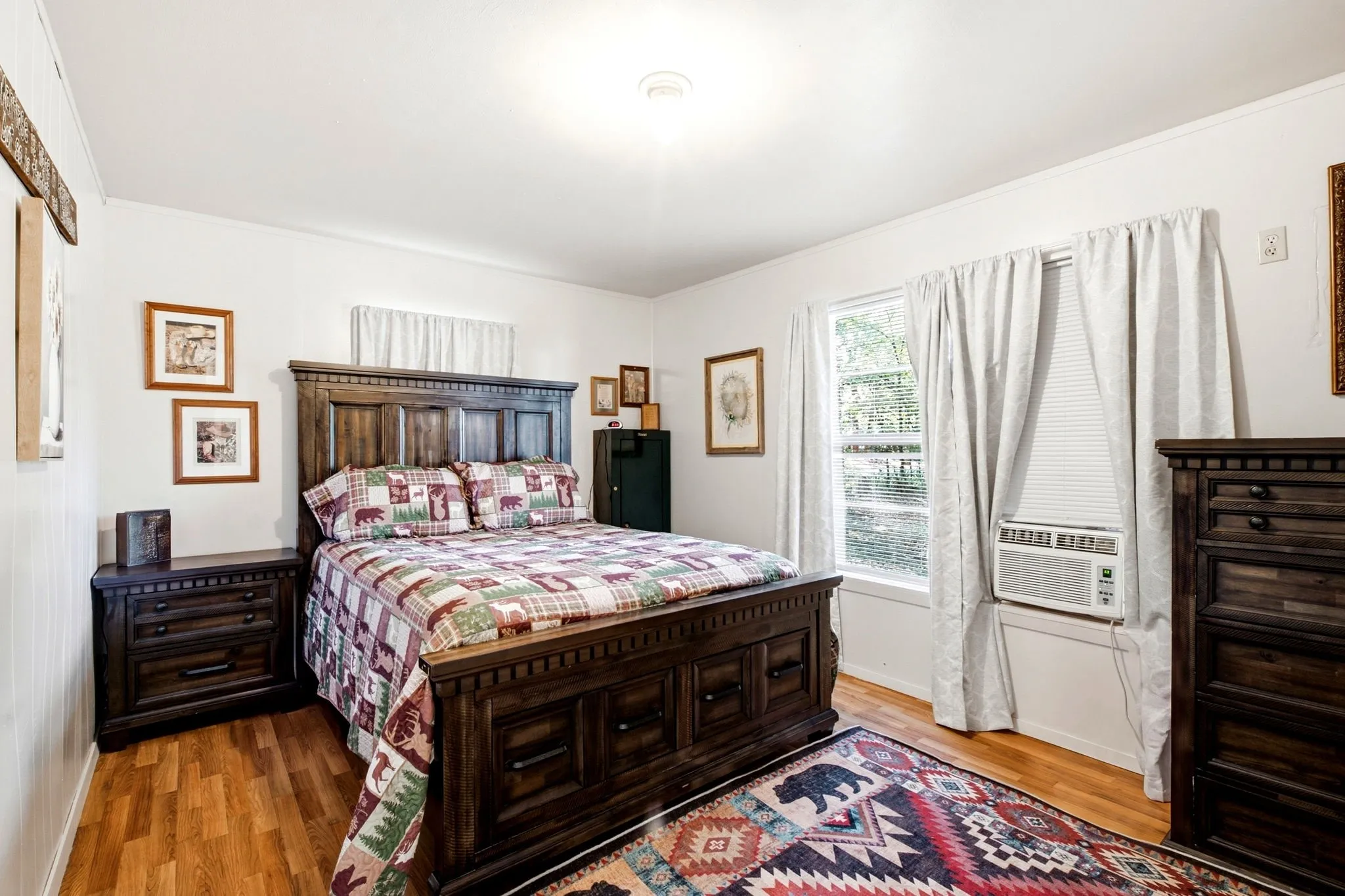 Wood-finish flooring with white walls and trim