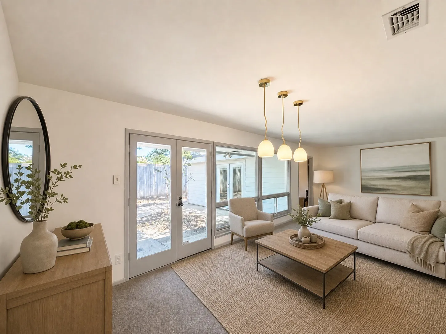Recessed lighting, triple pendant light fixture, French doors with exterior access, wall-mounted air vent, and carpet flooring