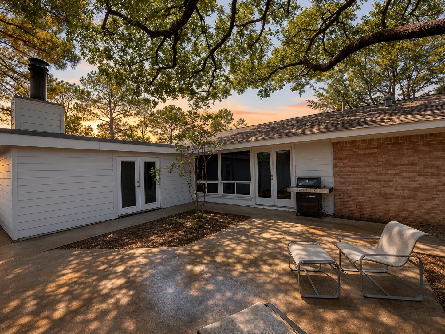 Private outdoor patio with a concrete surface