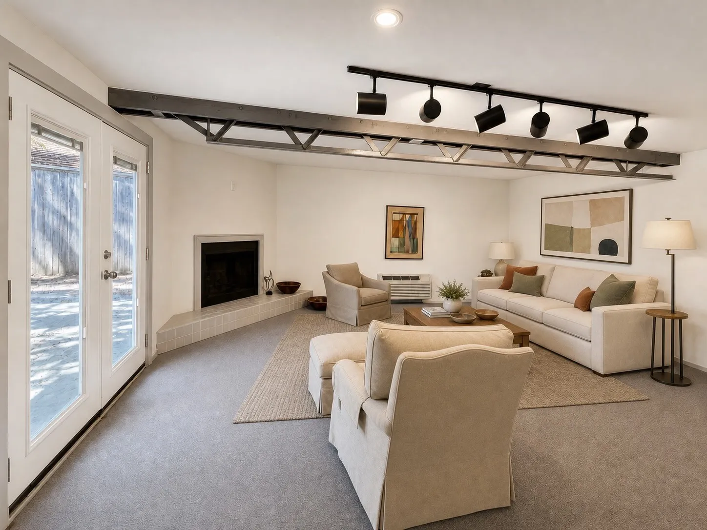 Recessed lighting and track lighting fixtures illuminate the space
