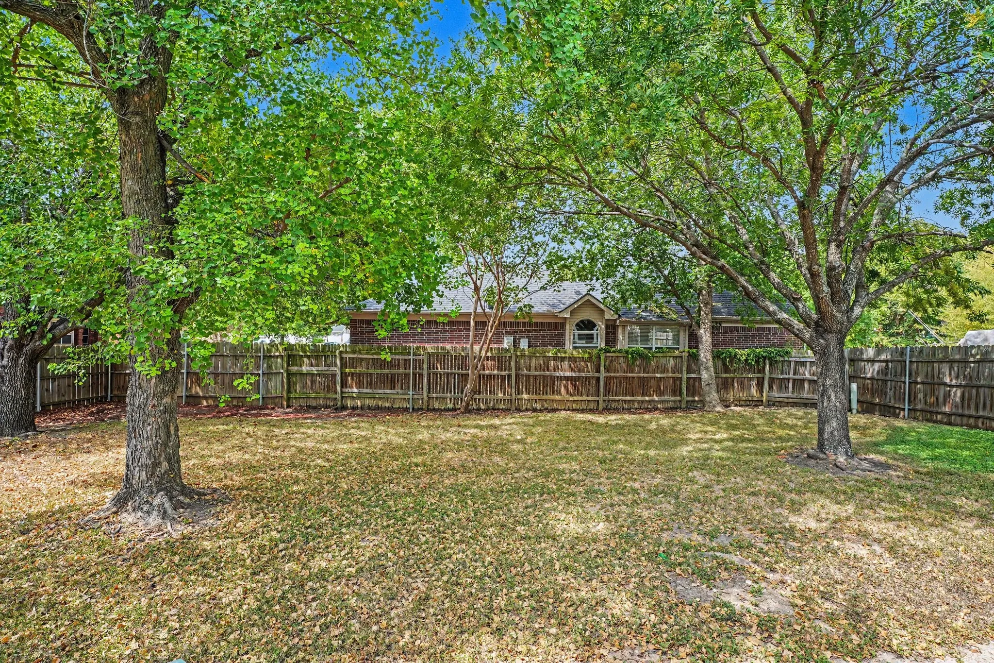 Large fenced-in corner lot