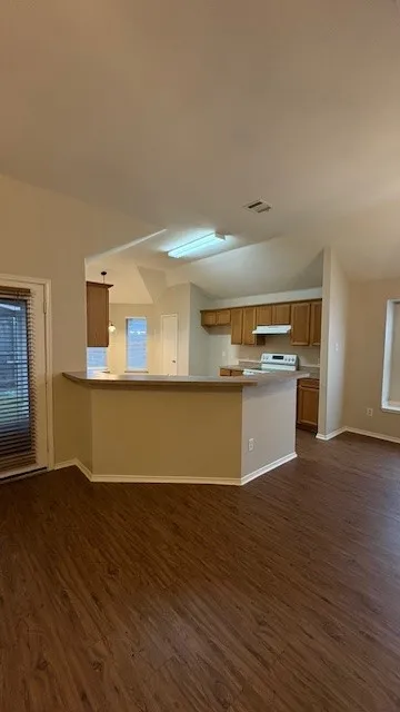 Kitchen has breakfast bar for additional sitting!