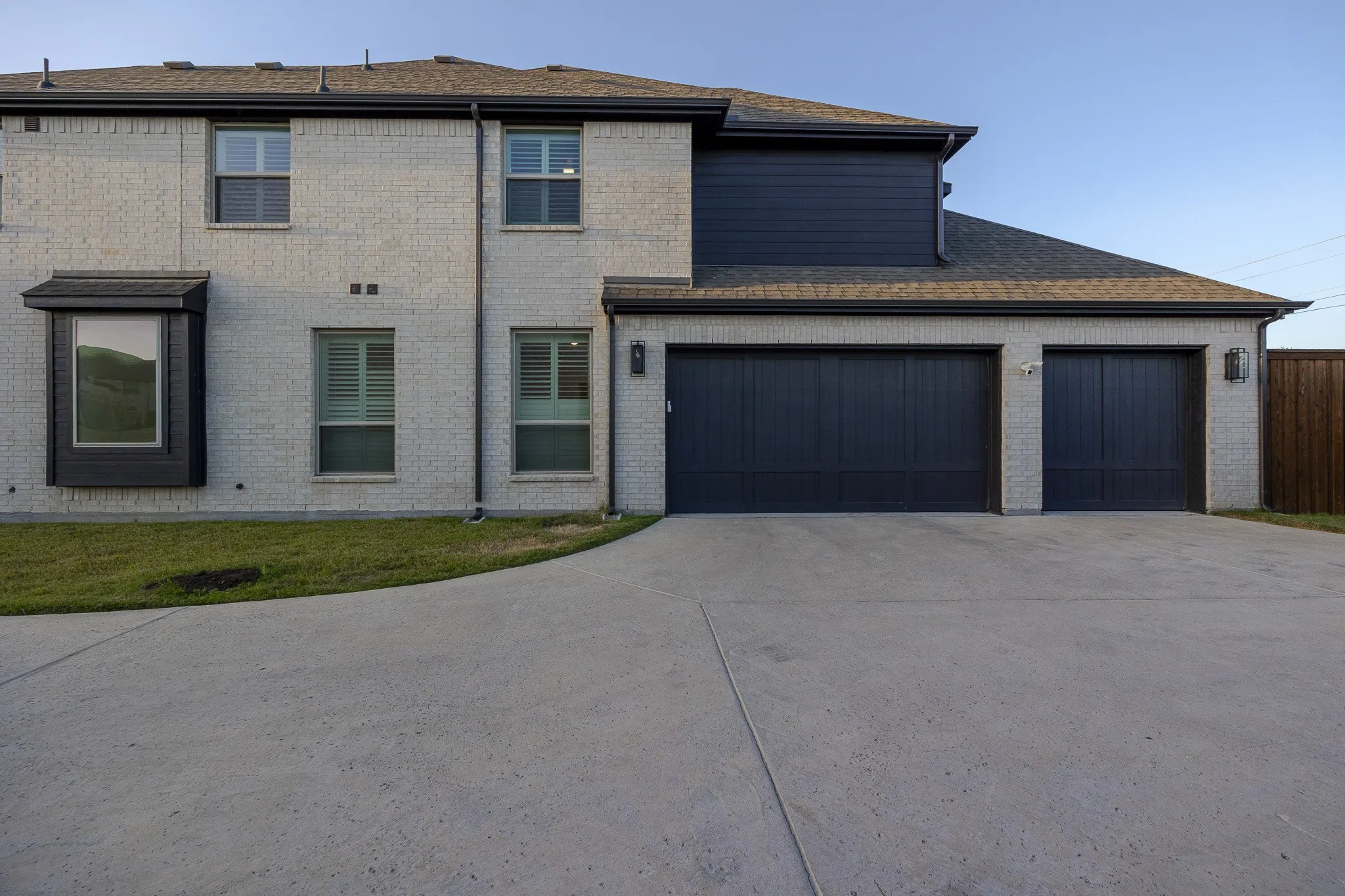 White brick exterior with dark trim accents