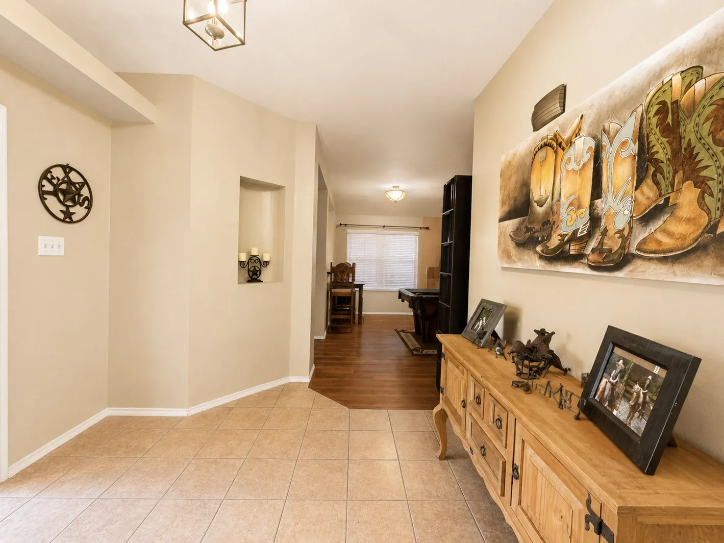 Recessed wall niche, overhead semi-flush mount fixture, and tile flooring