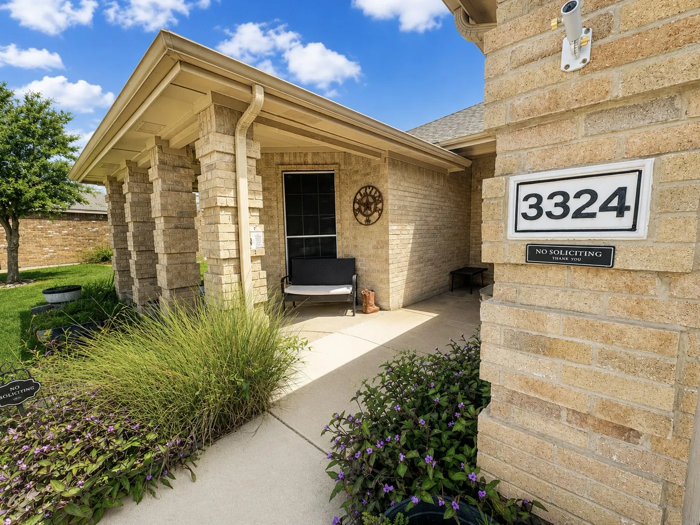 Brick exterior with substantial stone columns