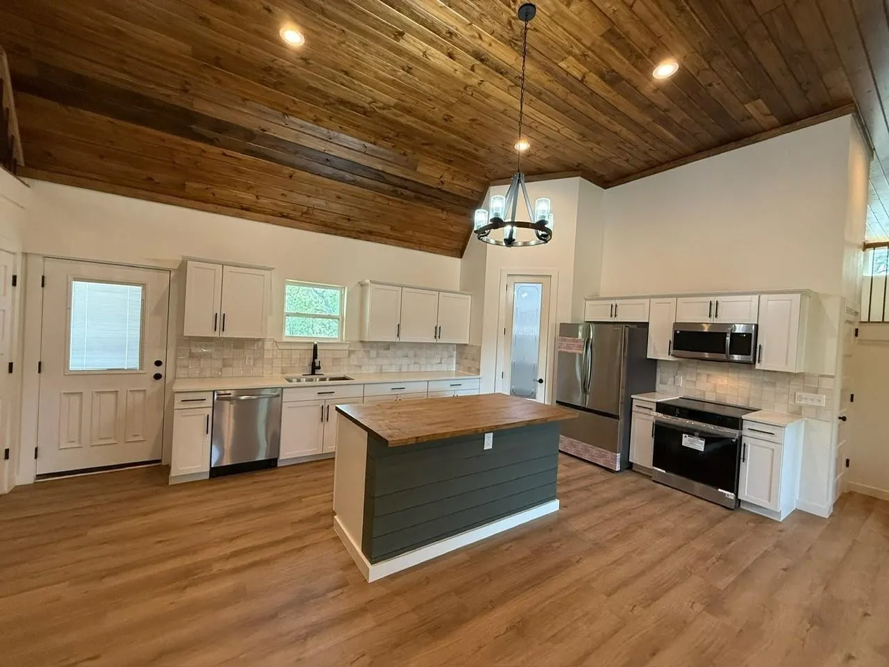 Vaulted wood-finish ceiling with recessed lighting