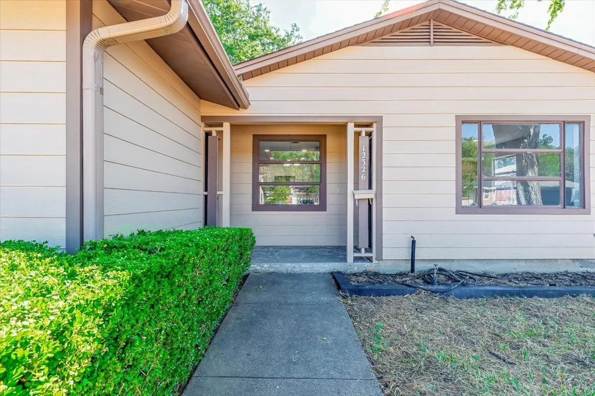 Siding exterior with contrasting trim accents and multiple windows