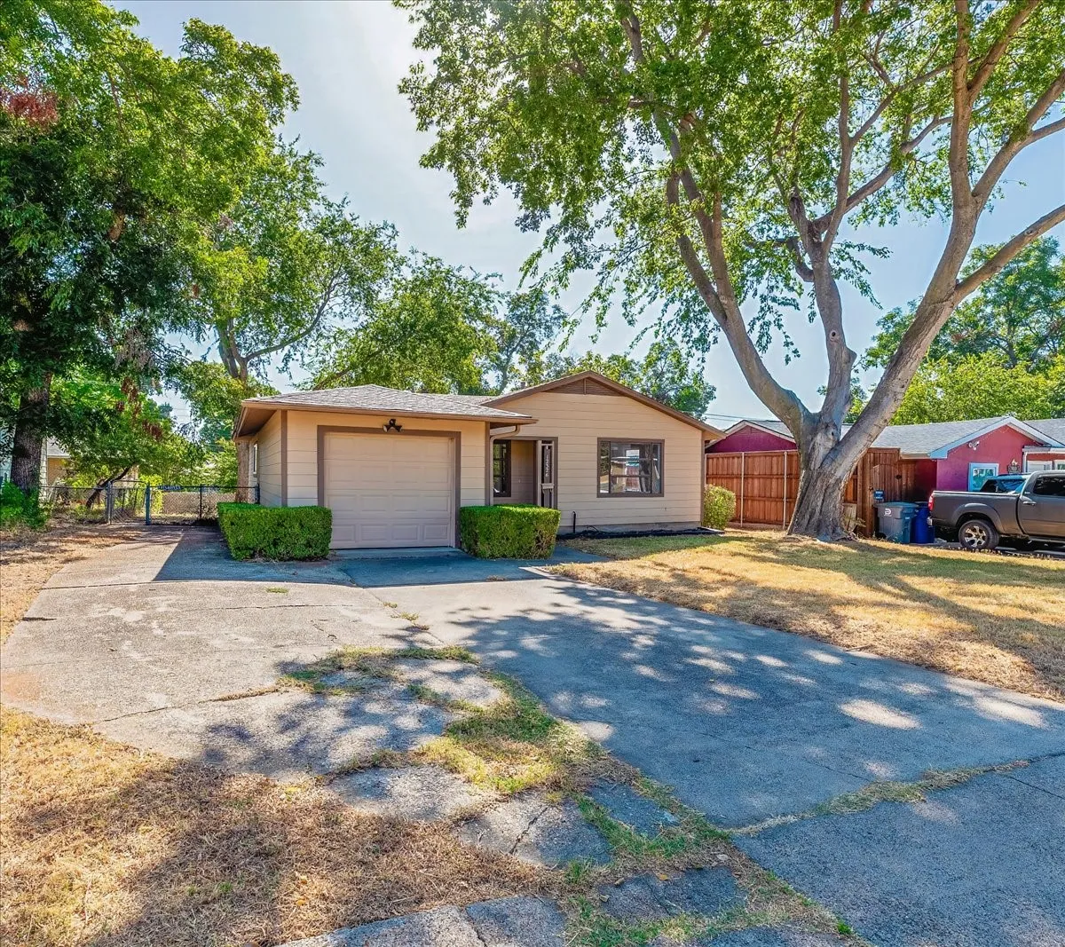 Single-story residence featuring a driveway, attached garag.