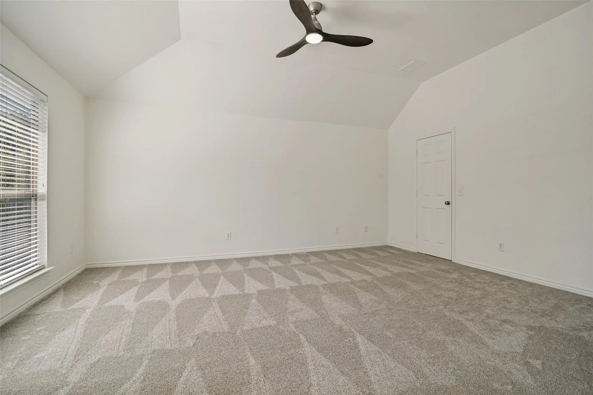 Vaulted ceiling with an attached ceiling fan