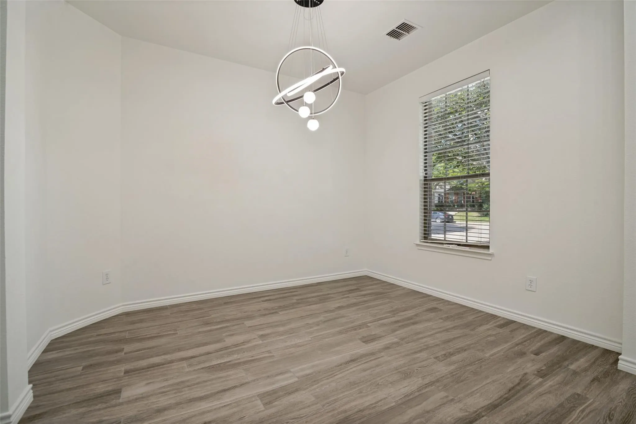 White walls and wood-finish flooring