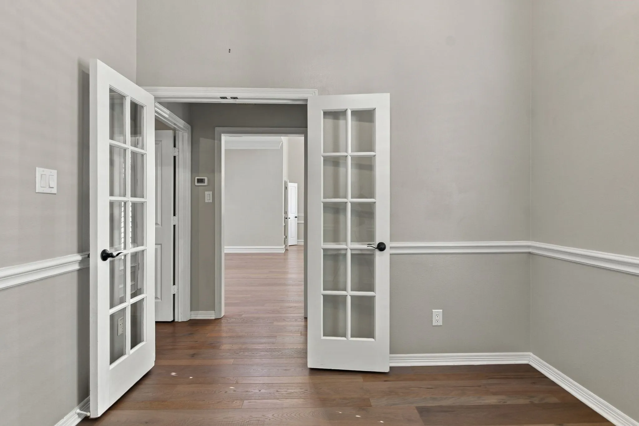 French doors highlight the office entry.