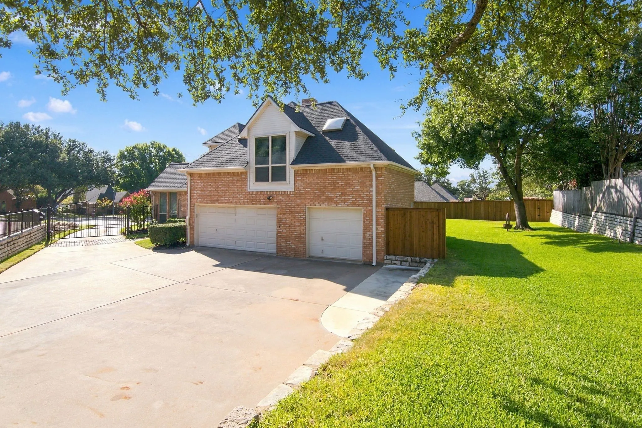 3 car garage and plenty of parking.  The iron gate provides enhanced security.