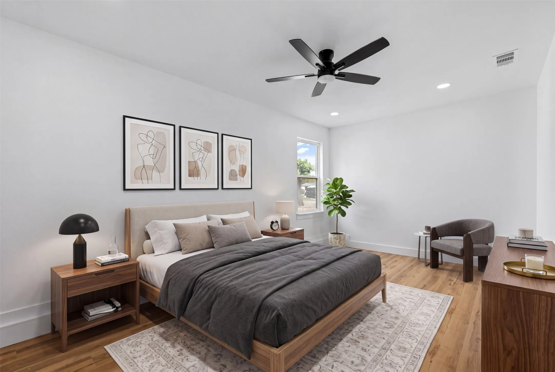 Wood-finish flooring throughout, white walls, and a recessed lighting package