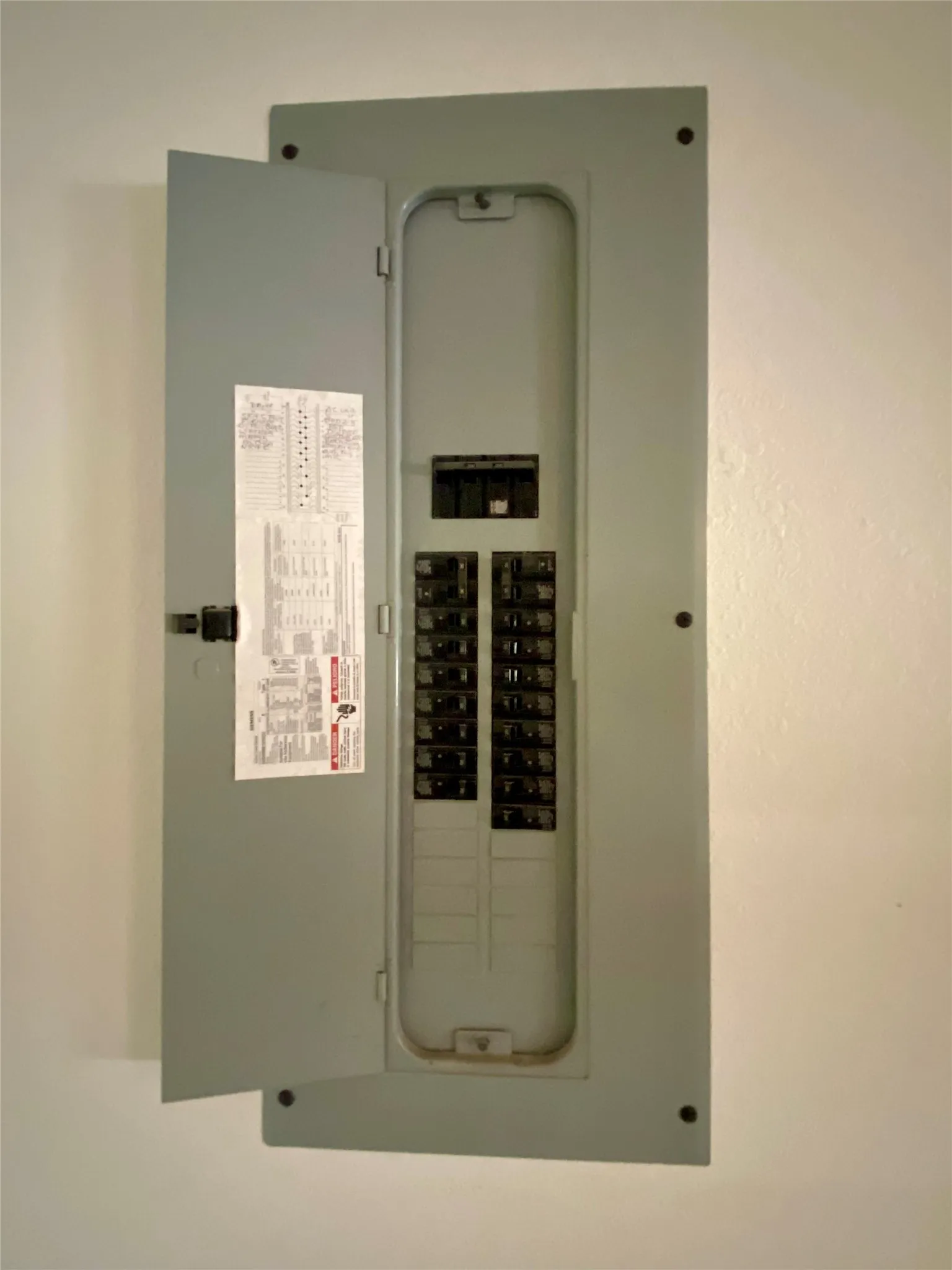 Electrical service panel featuring multiple circuit breakers