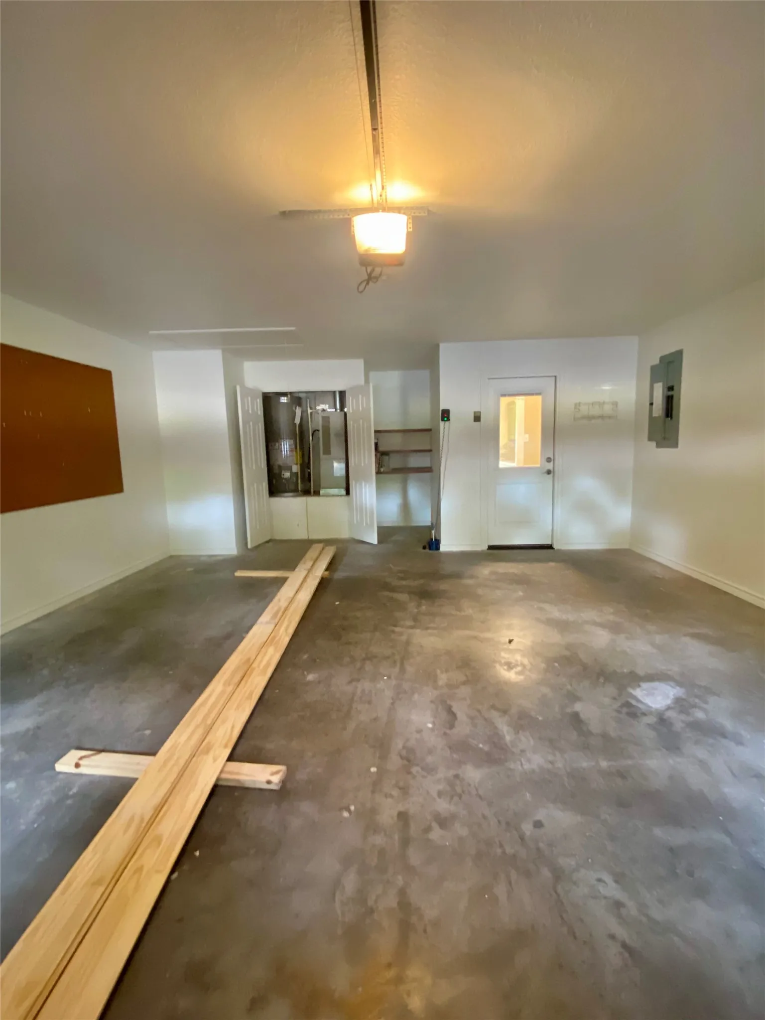 Garage with HVAC/Water heater closet