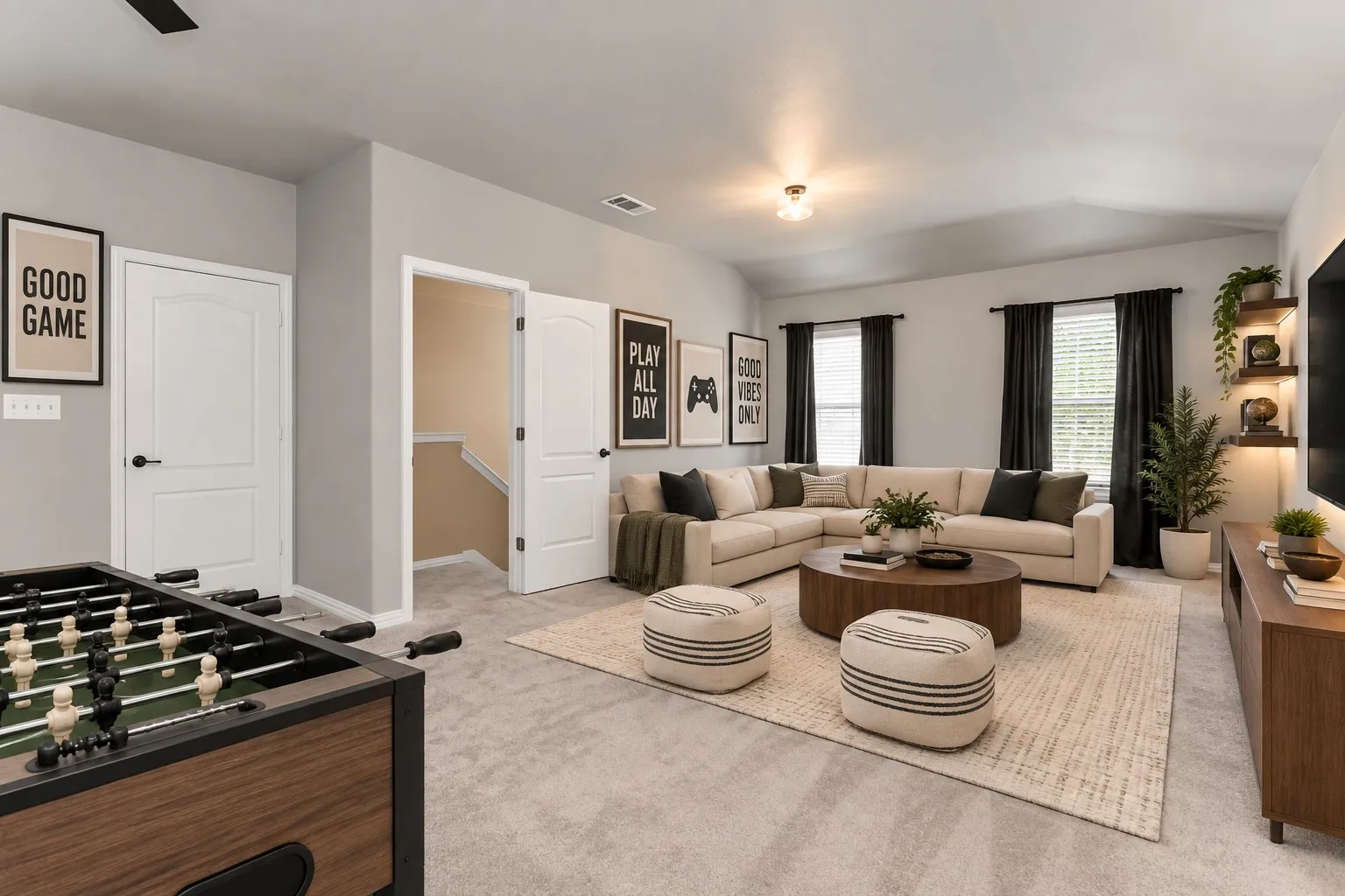 Carpeted living area featuring a vaulted ceiling and recessed lighting