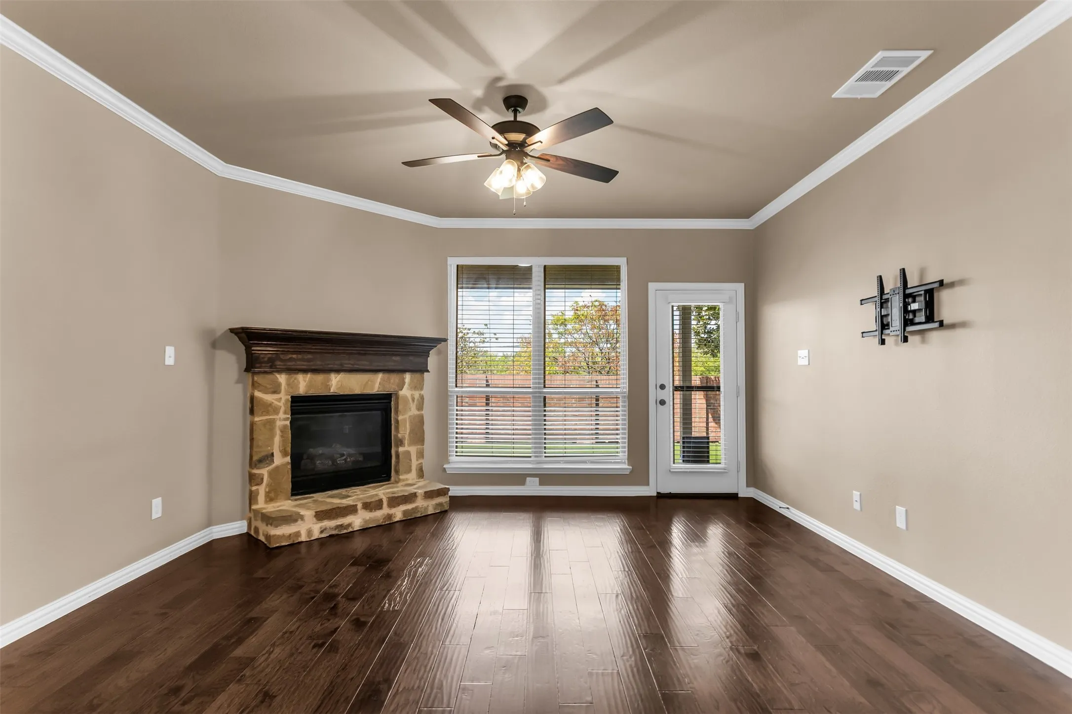 Stone-faced fireplace with a wood mantel
