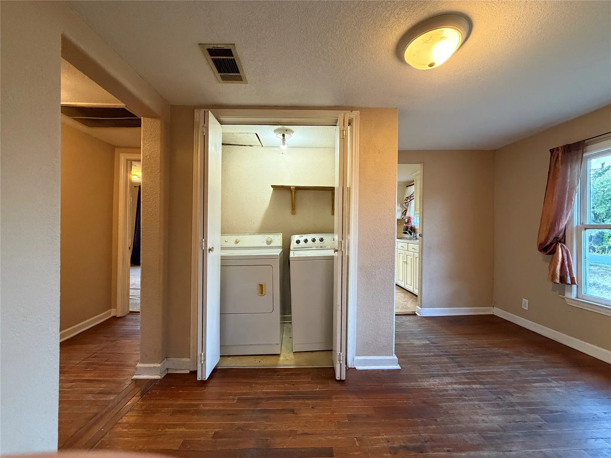 Laundry closet centrally located in dining room