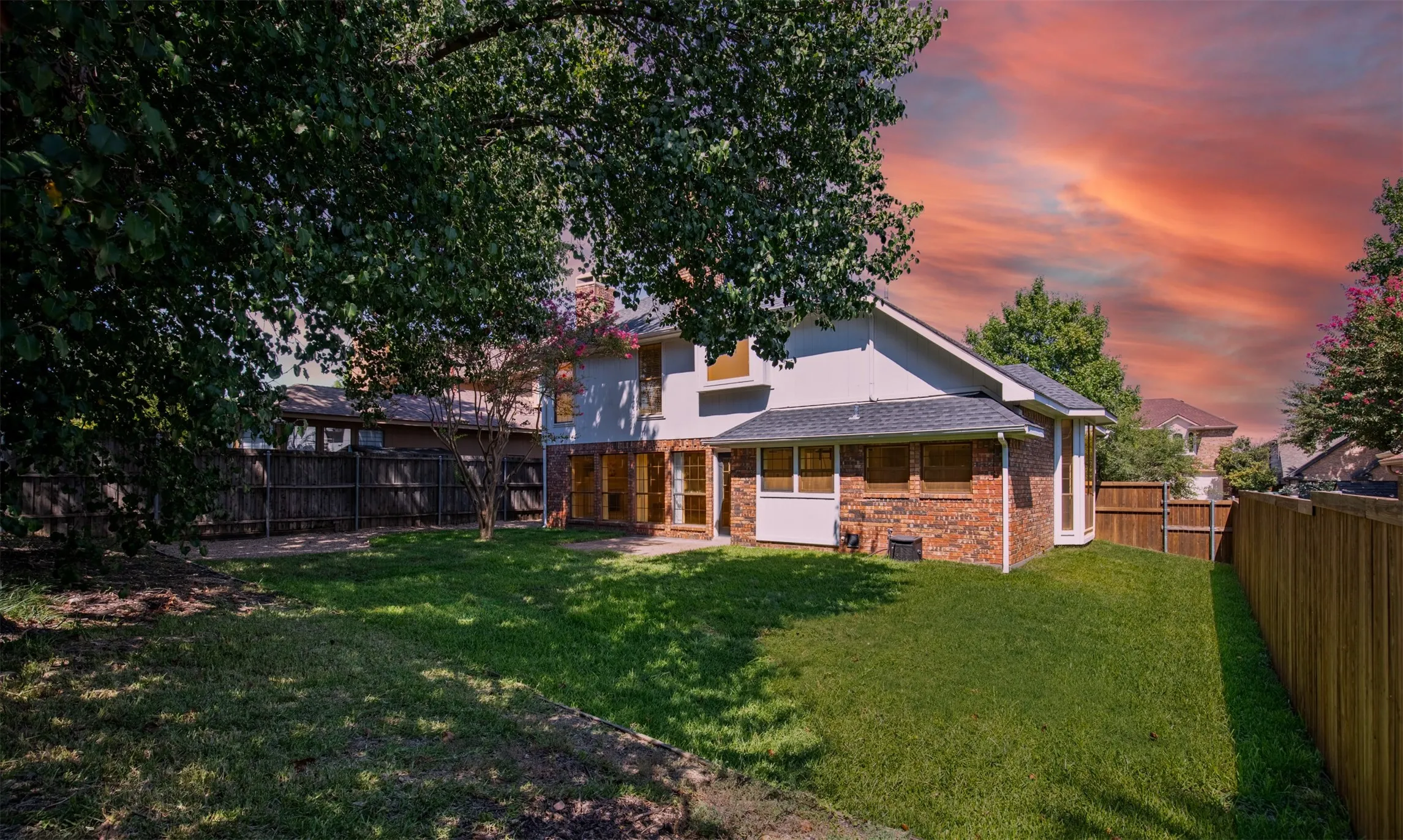 Shaded back yard with side yard.