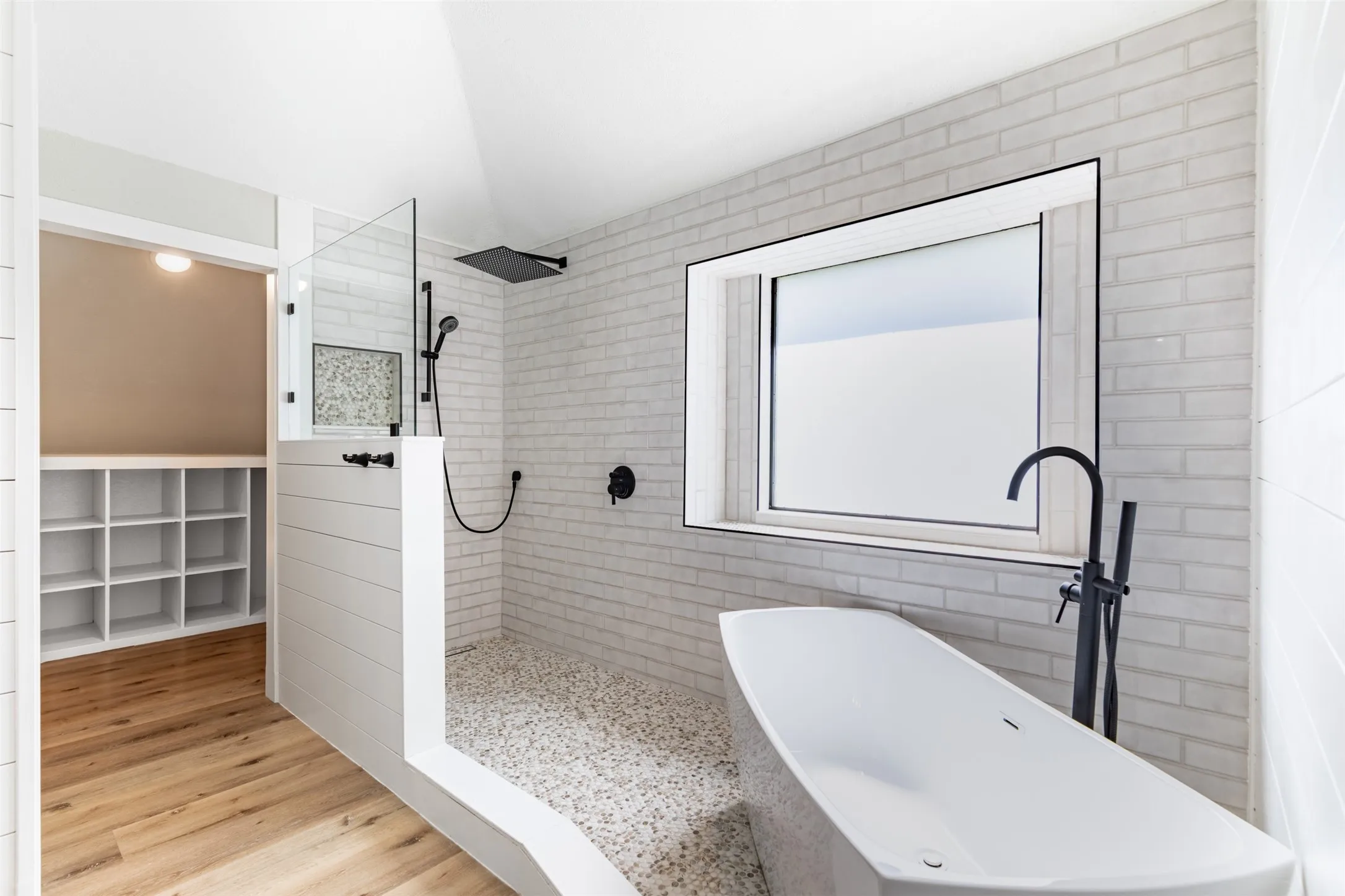 En-suite bath with walk-in shower and soaking tub.