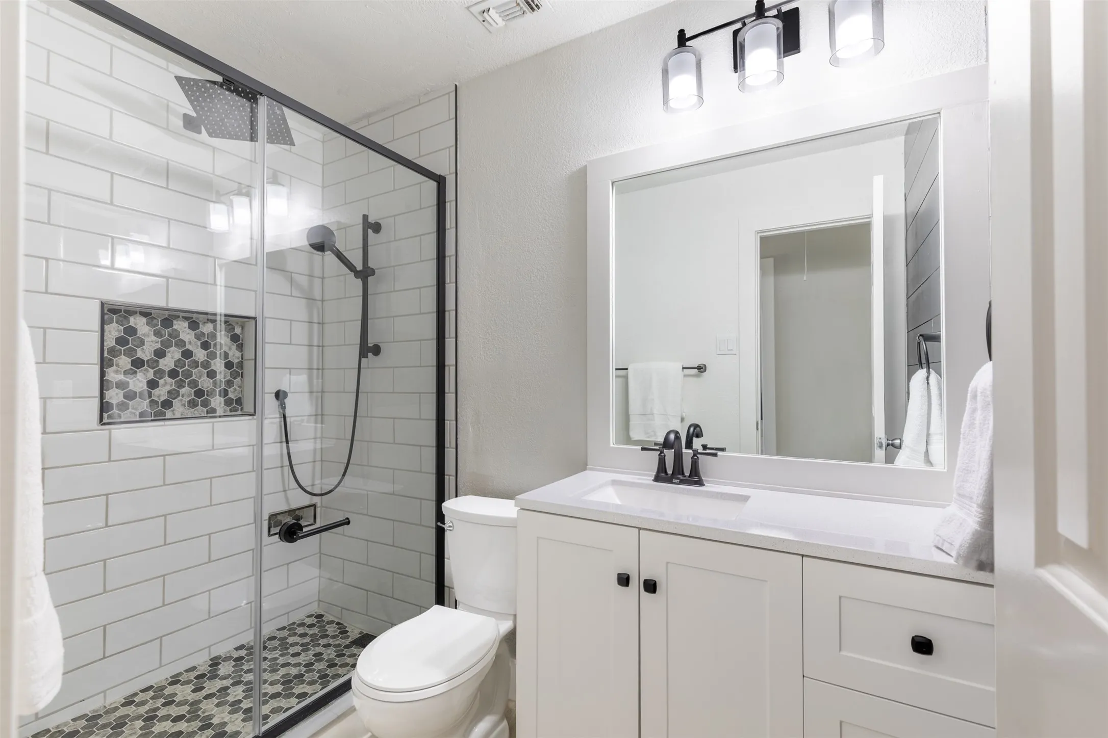 Upstairs secondary fully remodeled bath.