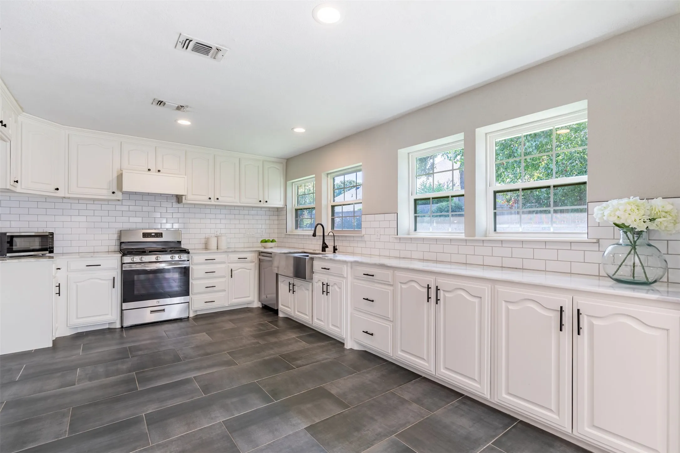 Kitchen with plenty of work space and natural light.