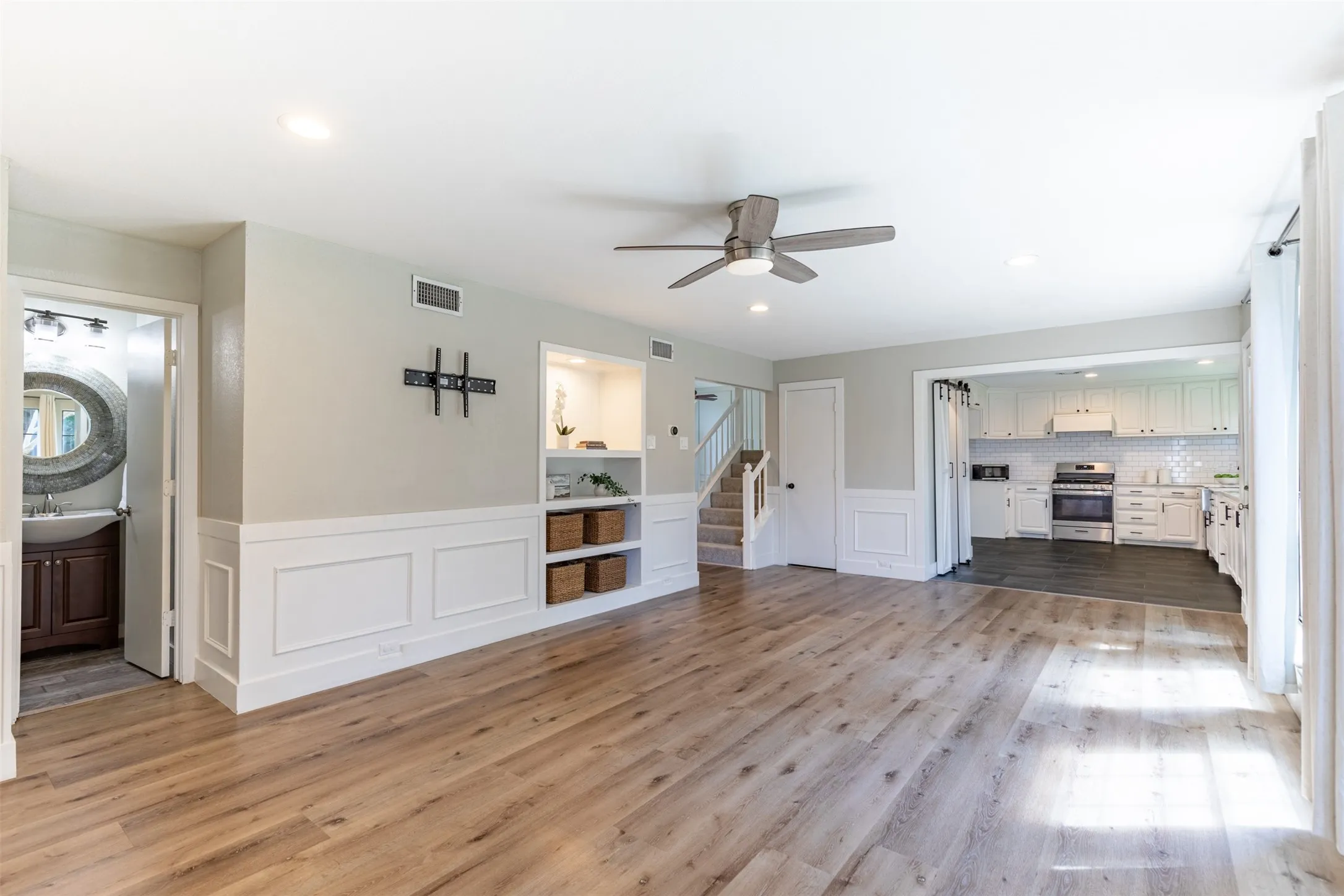 Family room showcasing half bath.