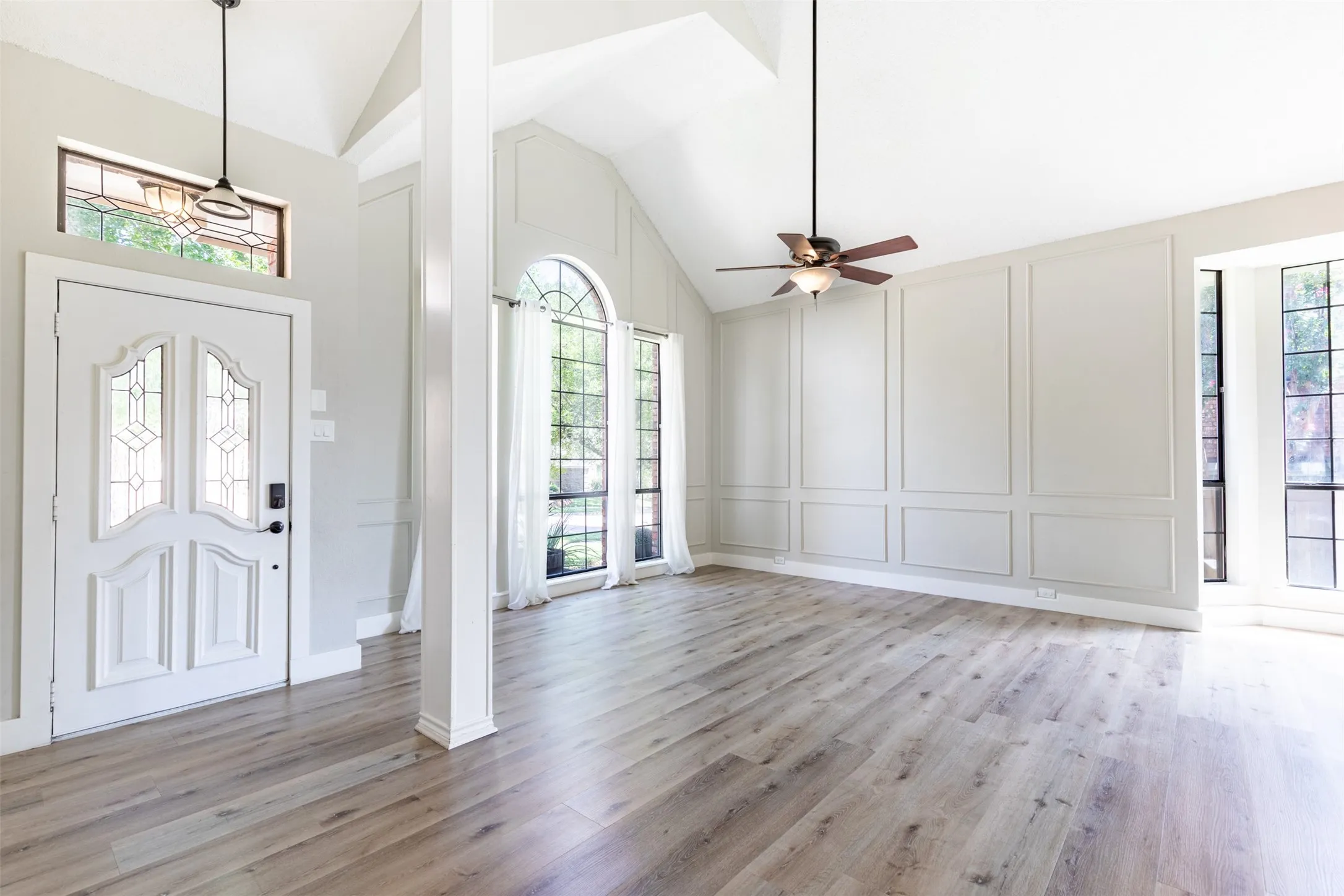 Stunning entry unfolds into the formal living room.