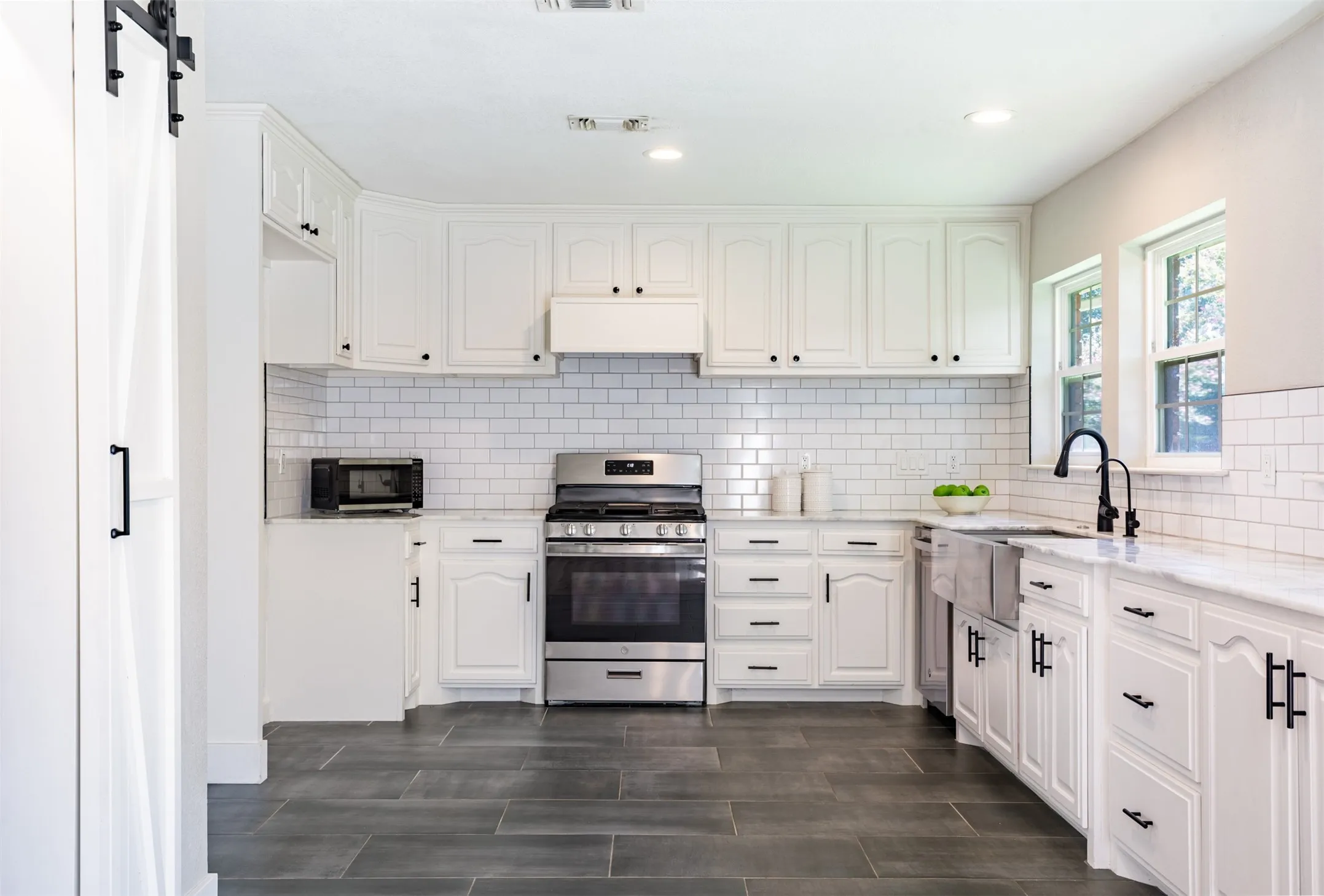 Kitchen with stainless steel appliances and an abundance of cabinetry.