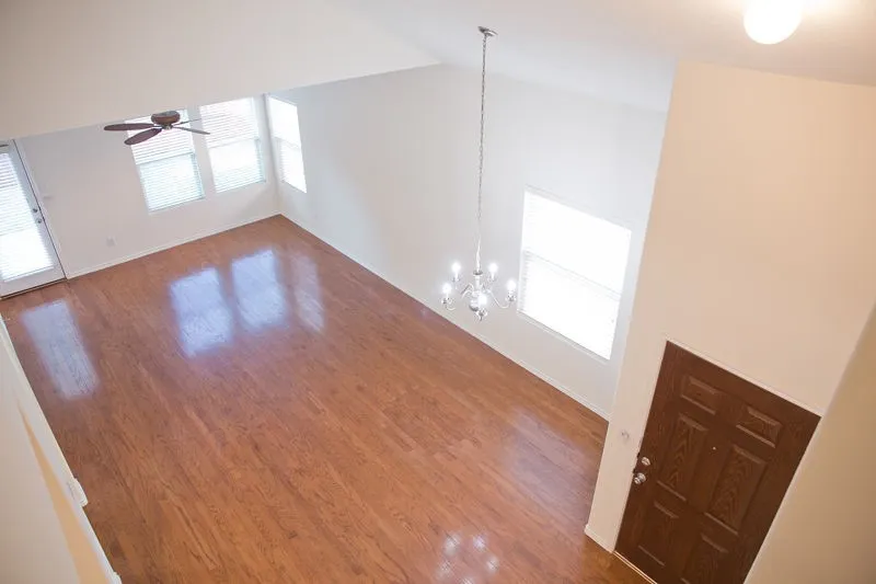 View of the family room/eating area from the top of the stairs.