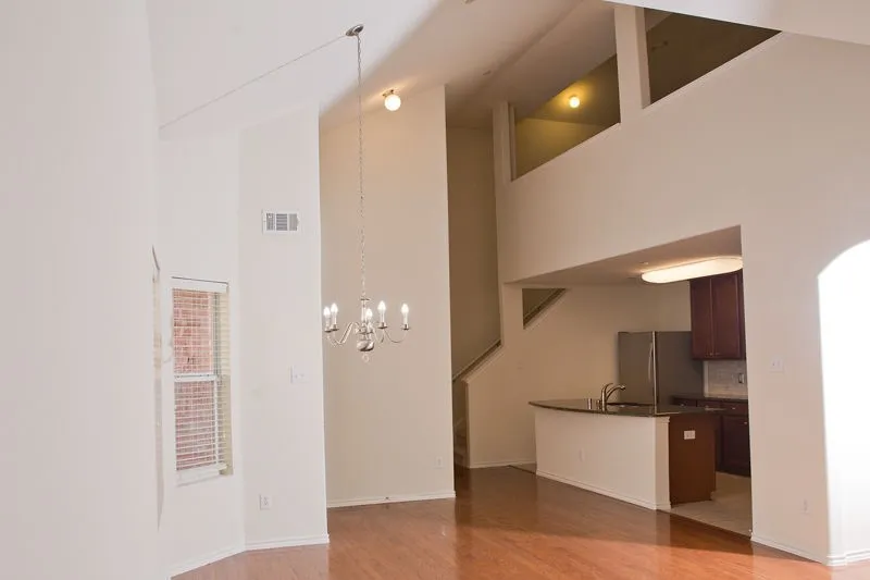 Eating area with soaring ceilings located directly across from the kitchen!