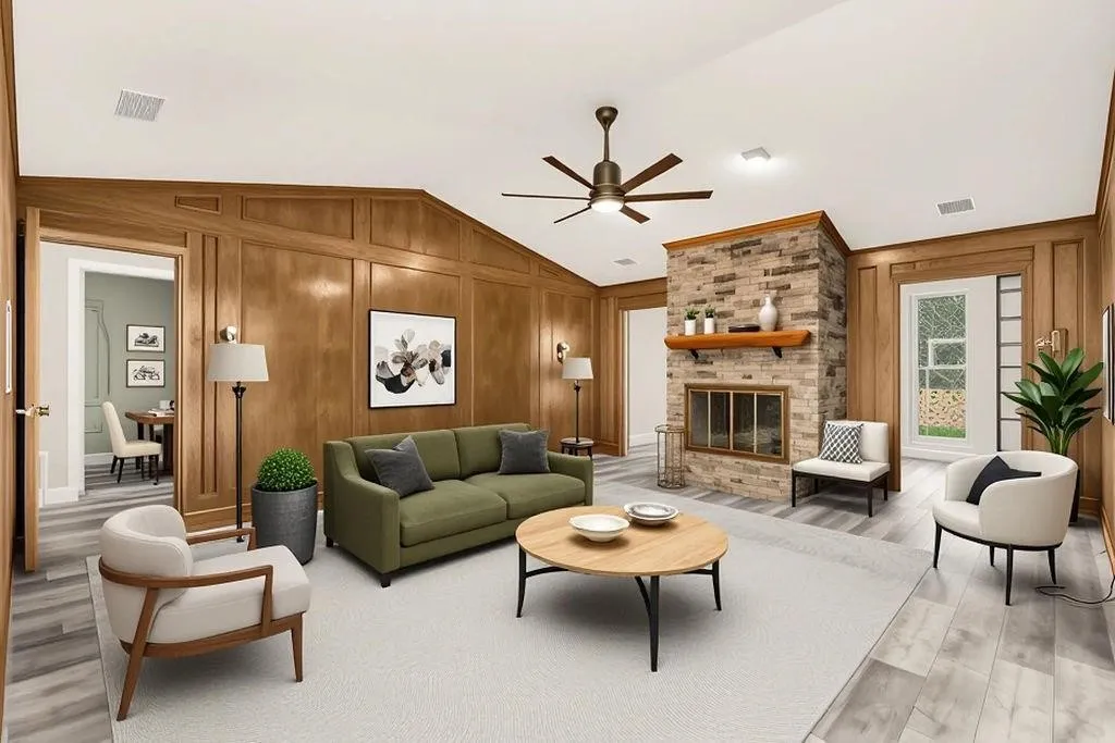 Wood paneling, stone-clad fireplace with wood mantel, vaulted ceiling with wood trim, ceiling fan, and wood-finish flooring