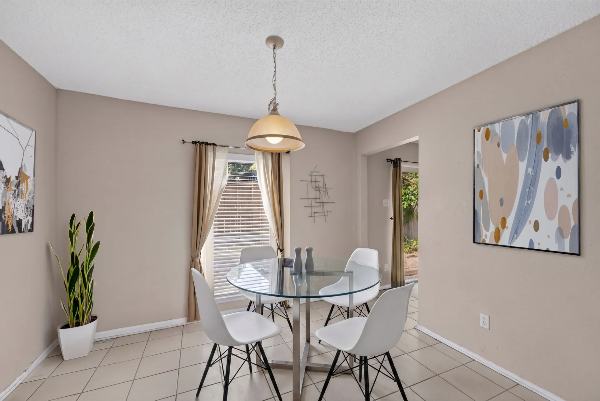 Recessed lighting and a single window with blinds illuminate the interior