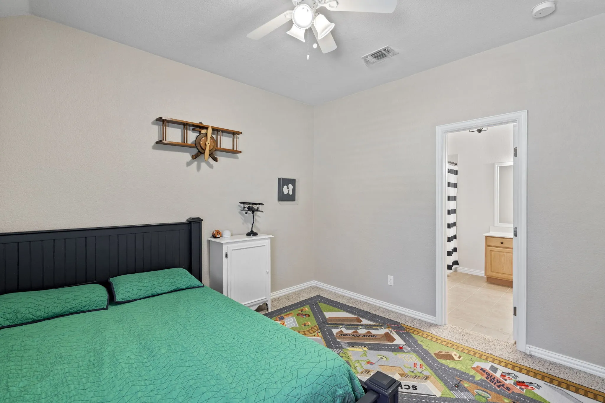 Bedroom with neutral wall color and carpeted flooring