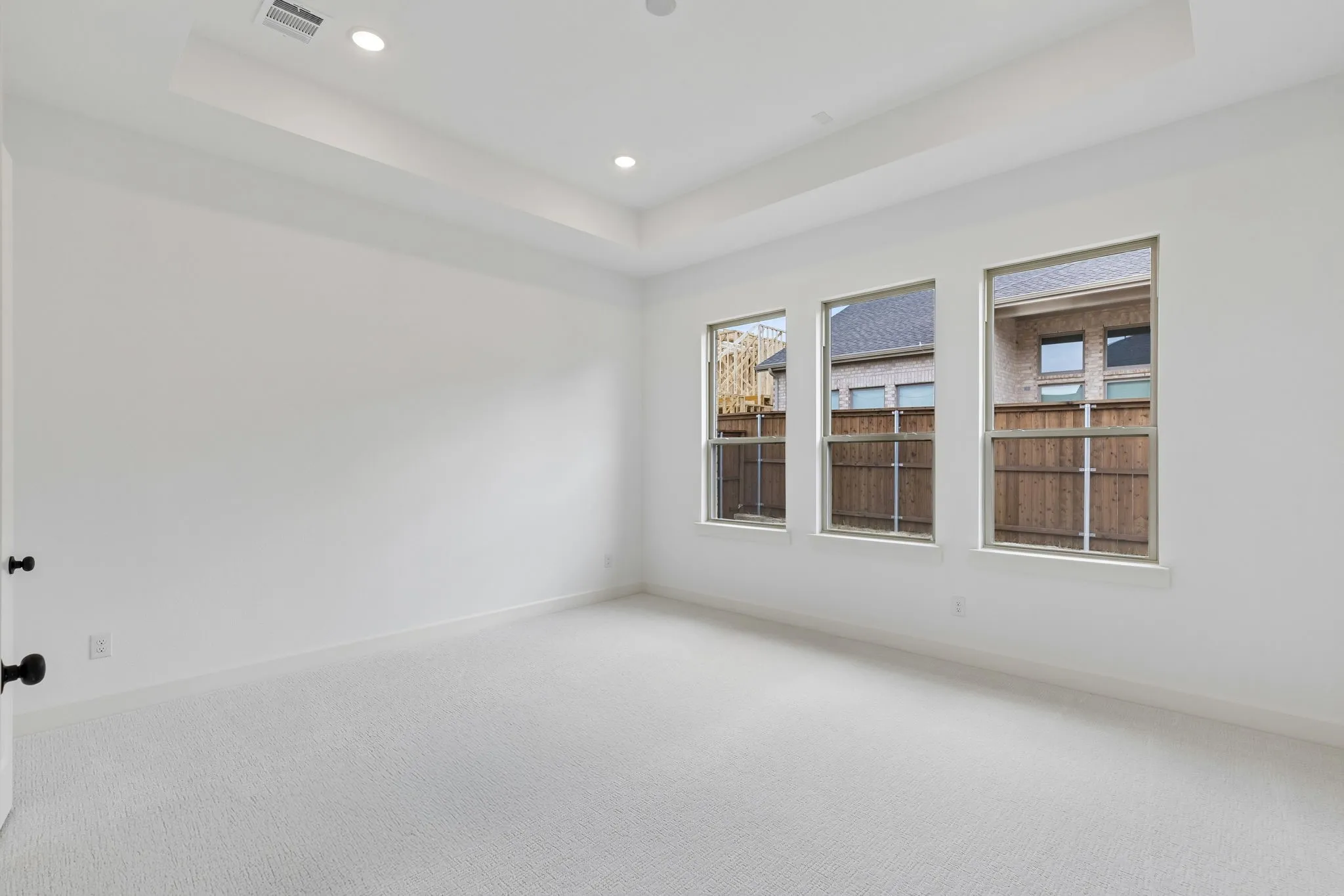 The light filled owner's suite is located at the back of the home for additional privacy.
