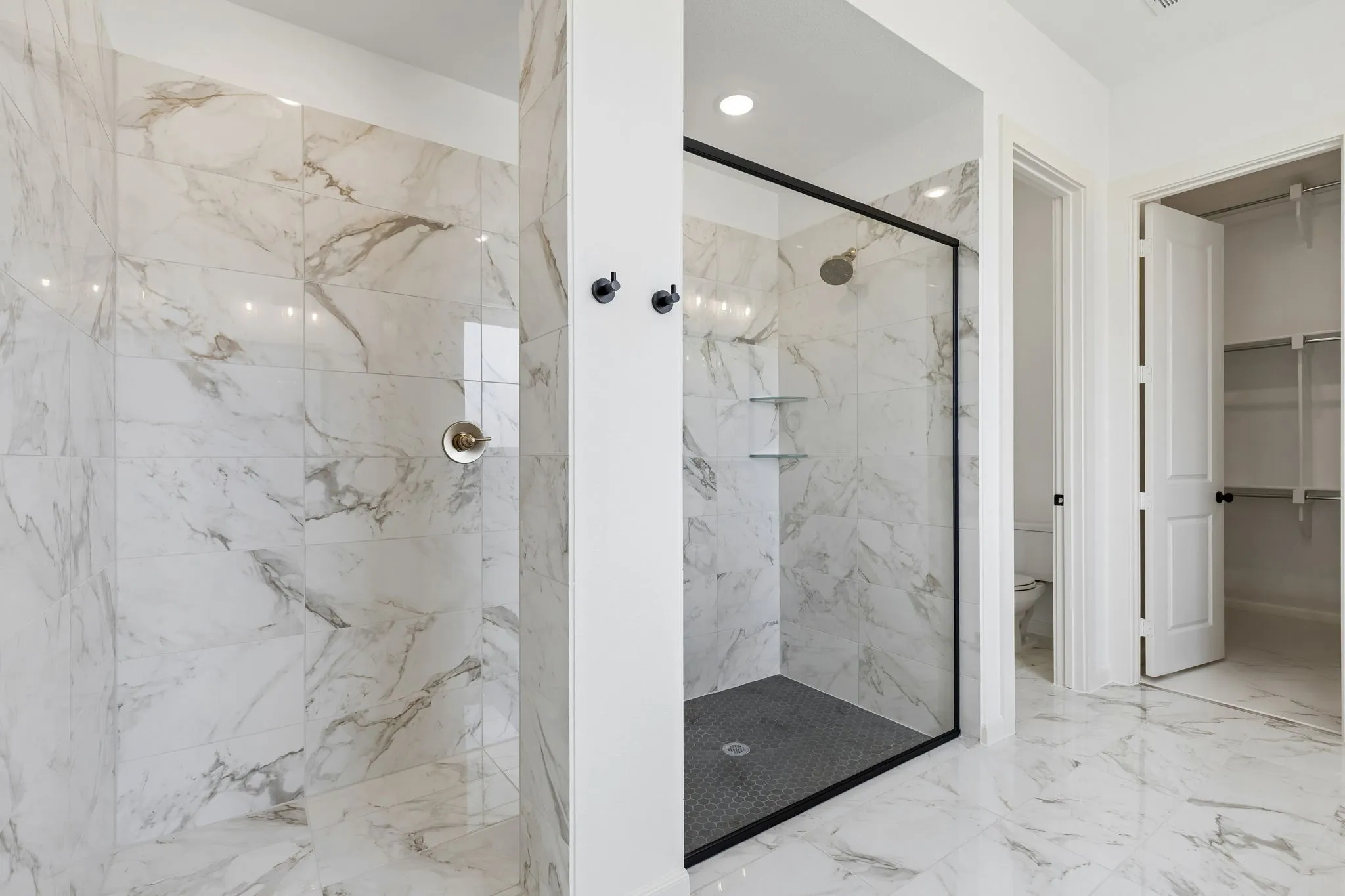 Your new owner's bath features a spacious walk in shower with drying area!