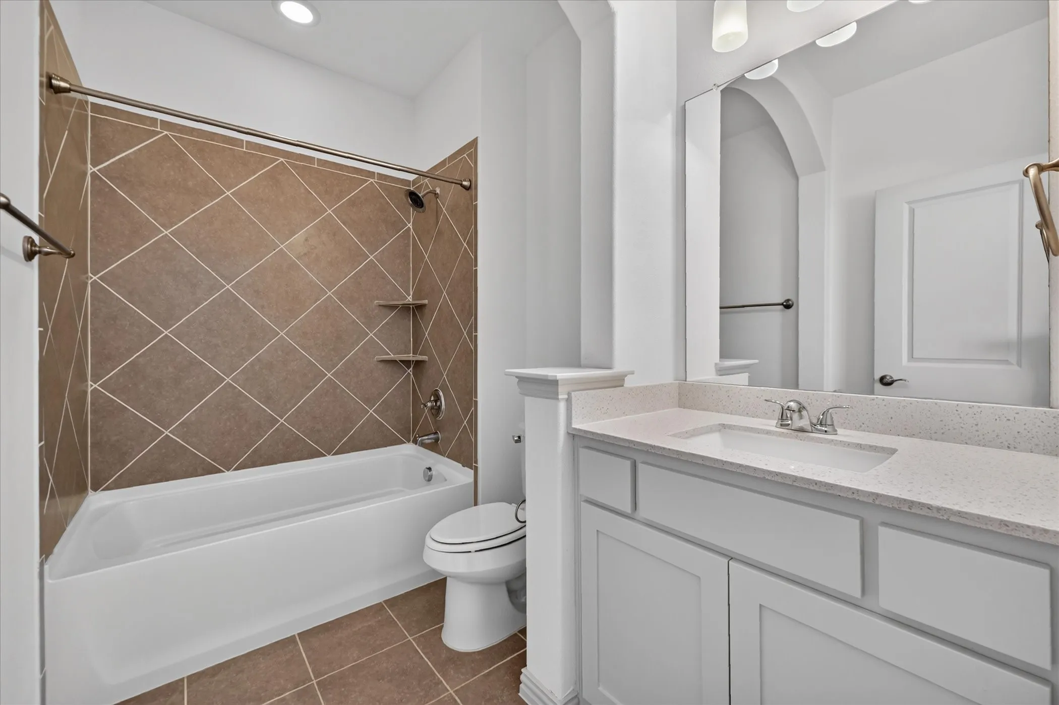 White vanity with a light-toned countertop, integrated sink, and chrome faucet