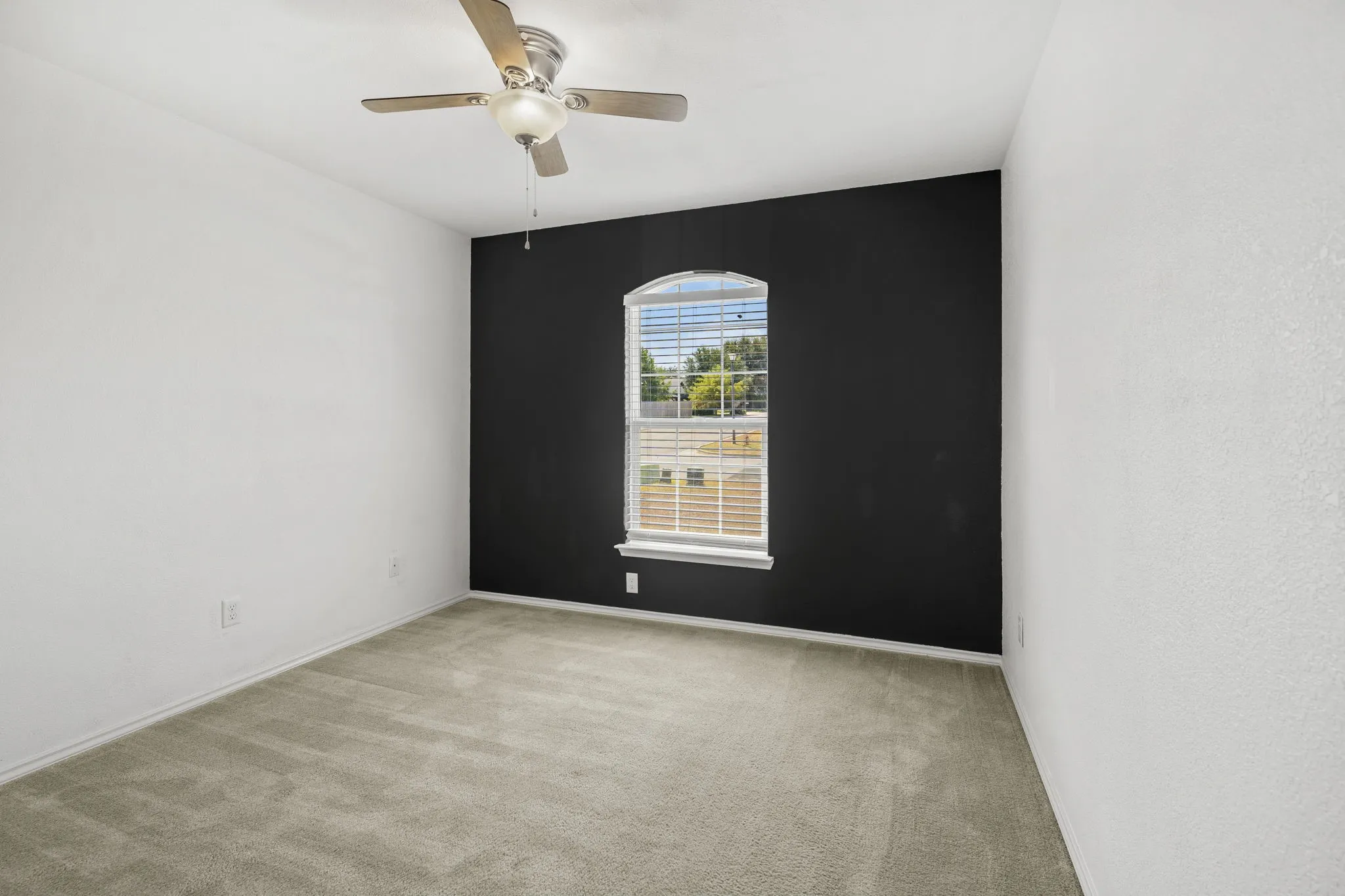 Utility area featuring a wire shelf system, appliance hookups, and tiled flooring