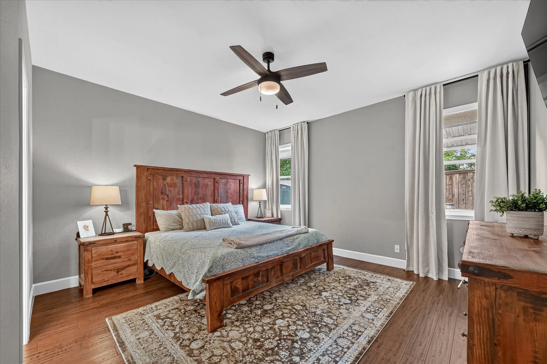 Large primary bedroom with beautiful bamboo floors.