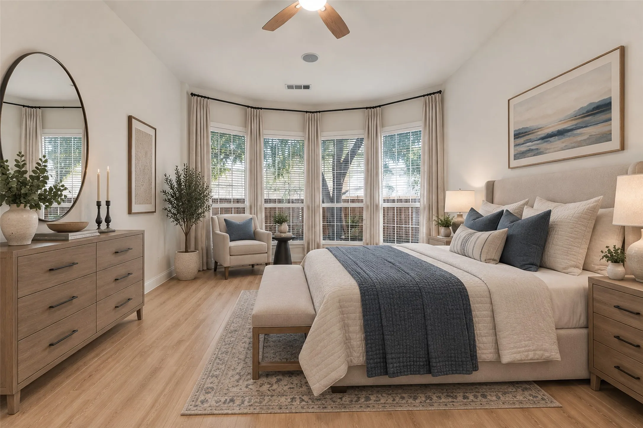 Virtually staged
Bay window with multiple large windows, wood-finish flooring, vaulted ceiling, and a ceiling fan with integrated lighting