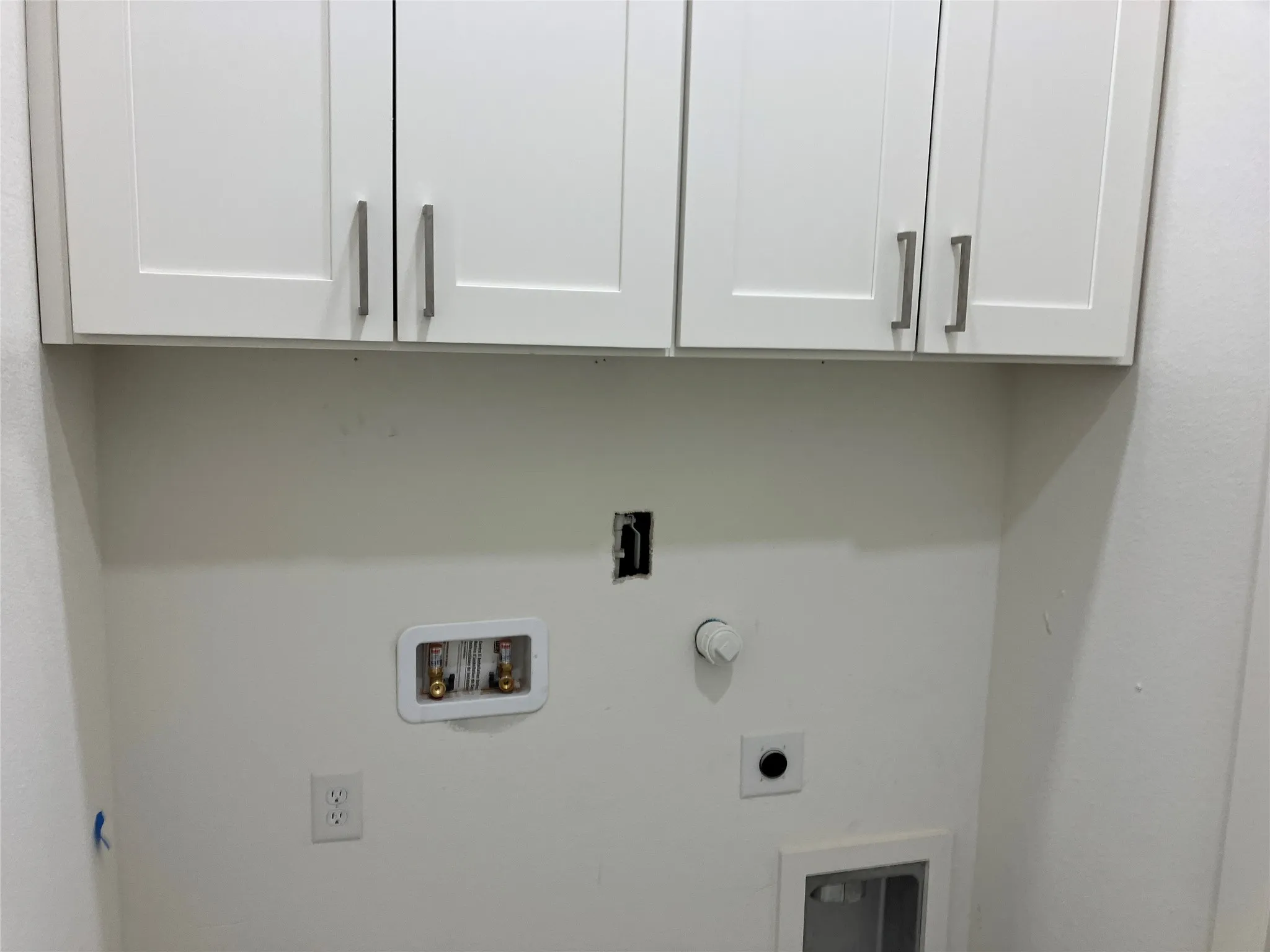 White shaker-style cabinetry with brushed nickel hardware