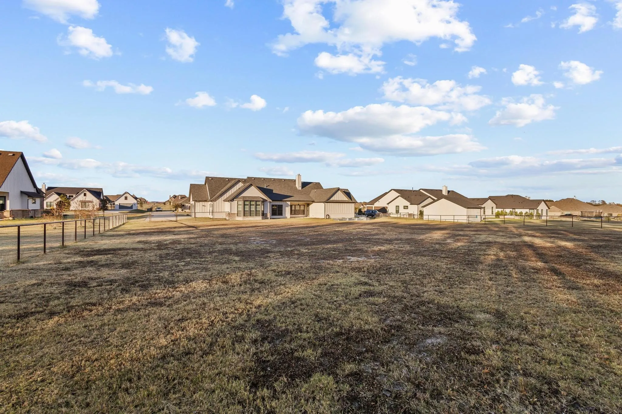 Fenced backyard , premium lot with a residential view