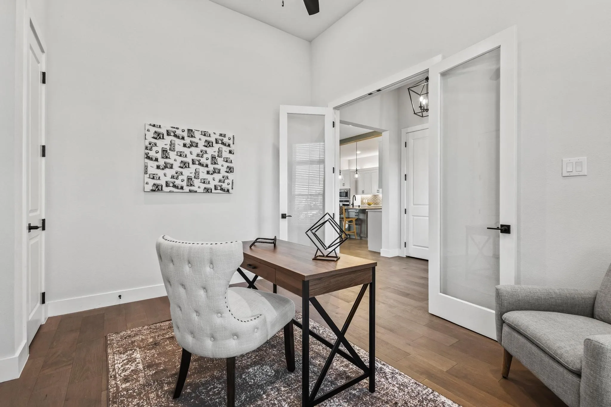 Office space featuring dark wood finished floors and ceiling fan