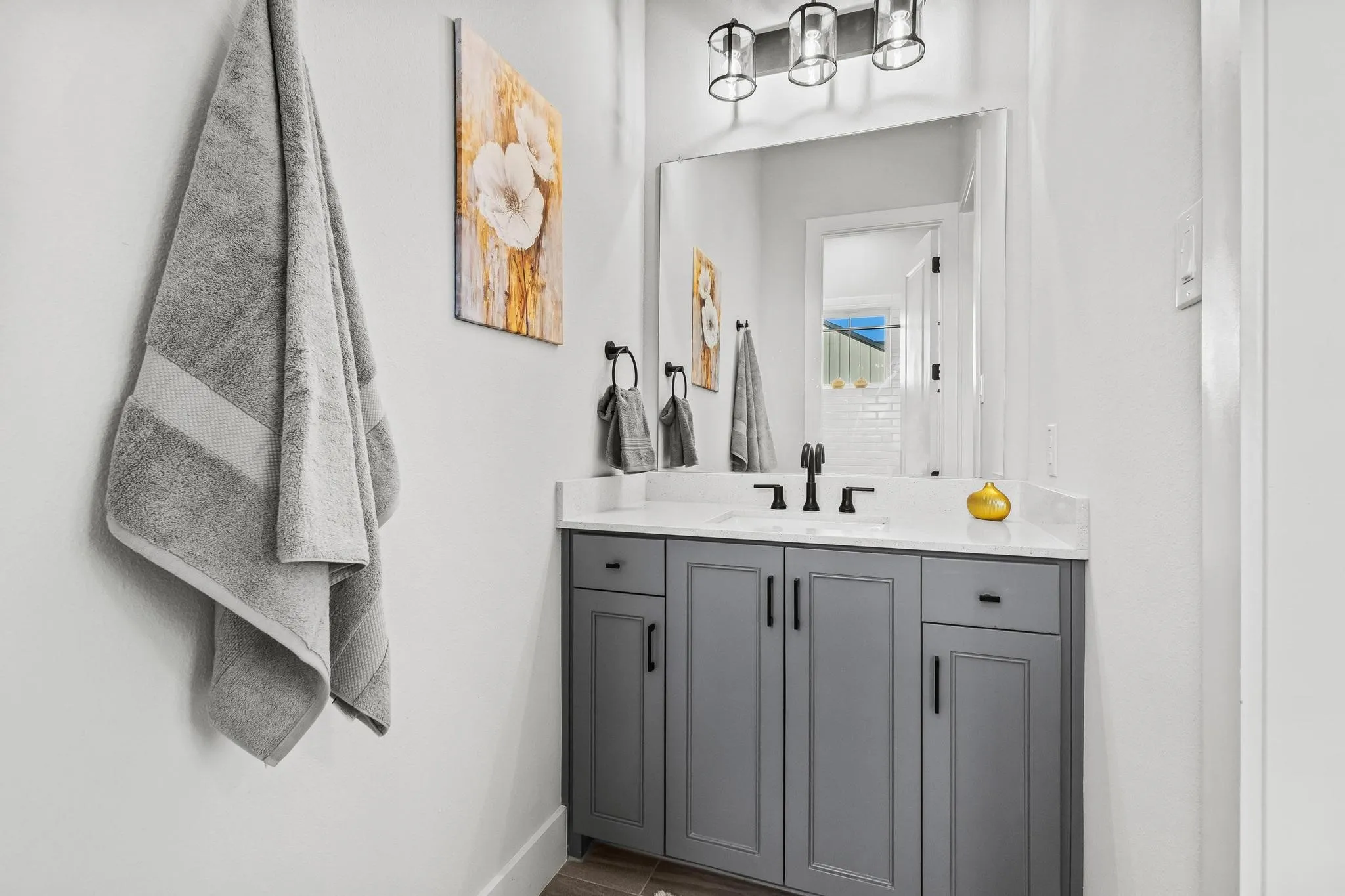 Jack and Jill bthroom with vanity and baseboards