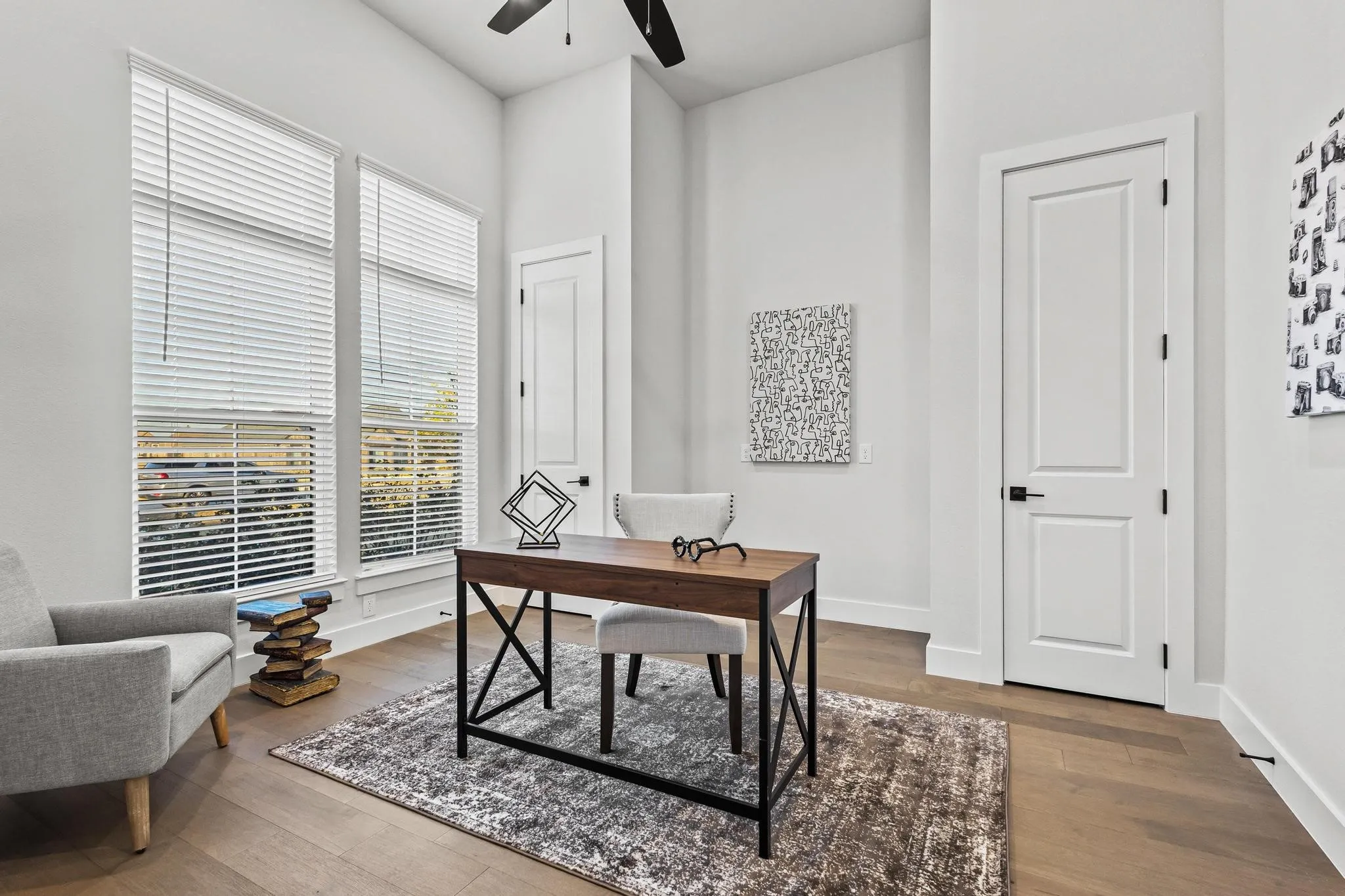 Office featuring dark wood-style floors and a ceiling fan