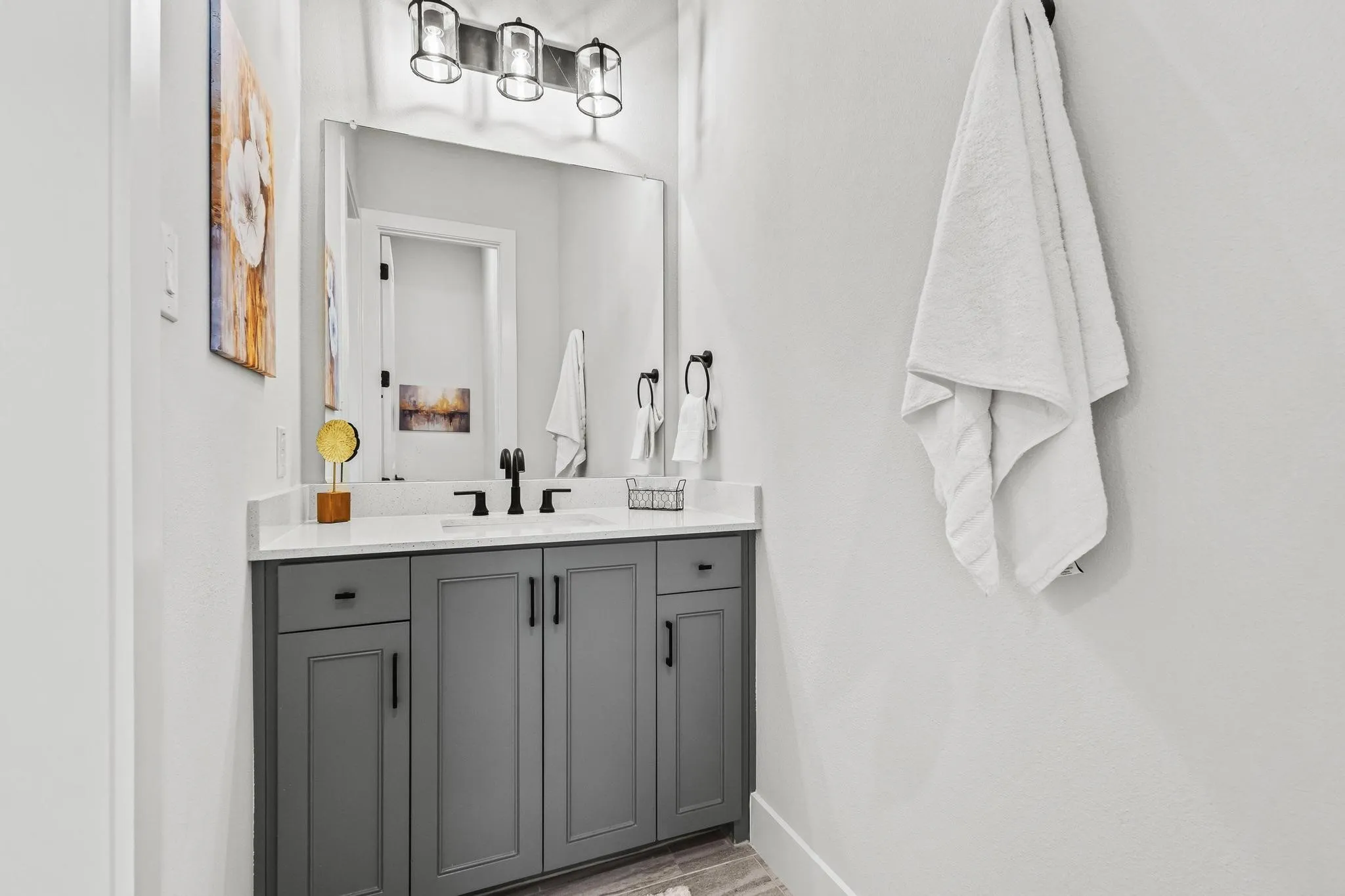 Bathroom with vanity and light wood-style floors