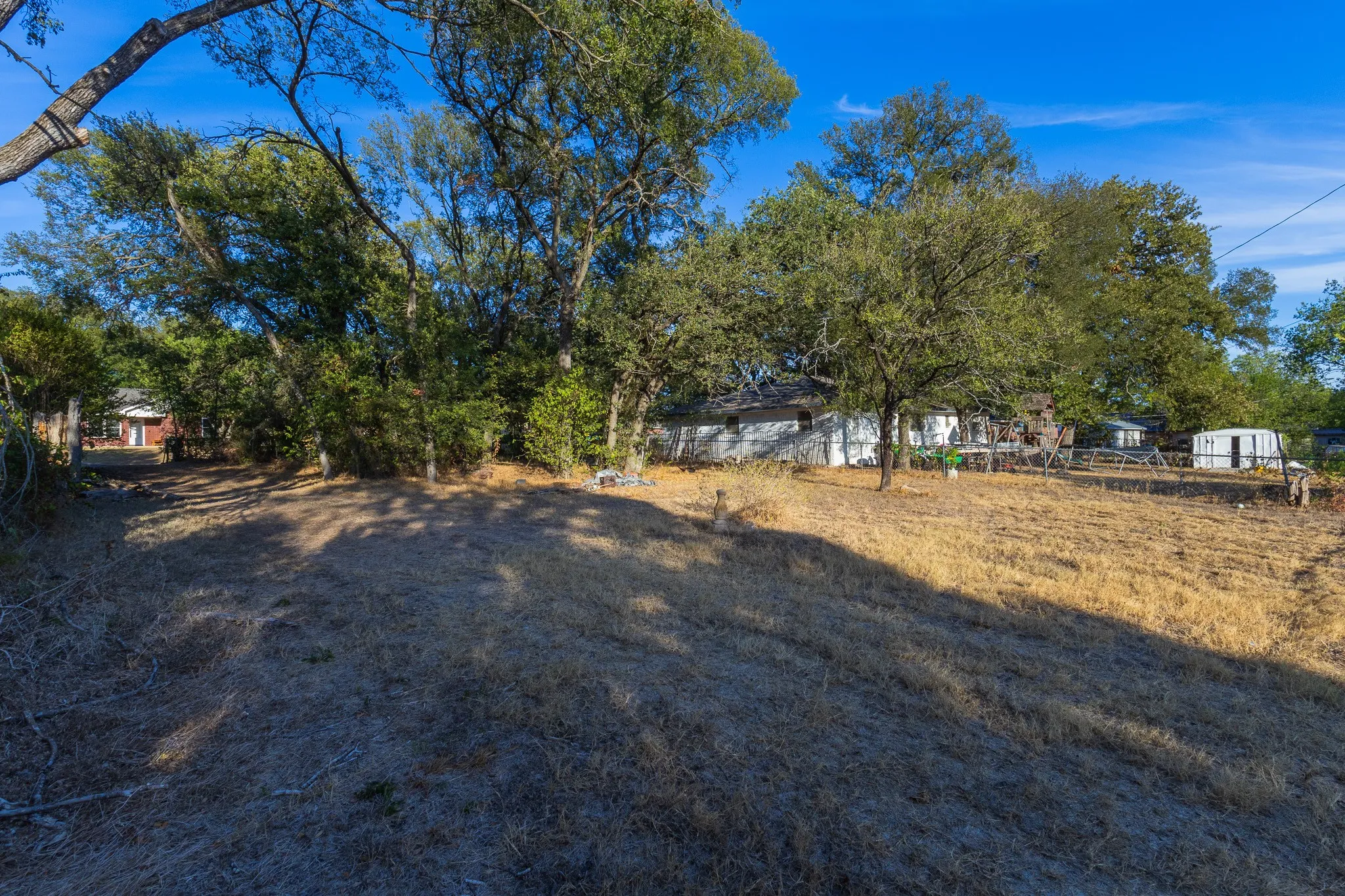 Expansive outdoor grounds featuring mature trees and open space