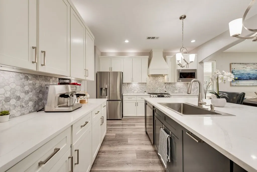 White shaker-style cabinetry with brushed nickel hardware